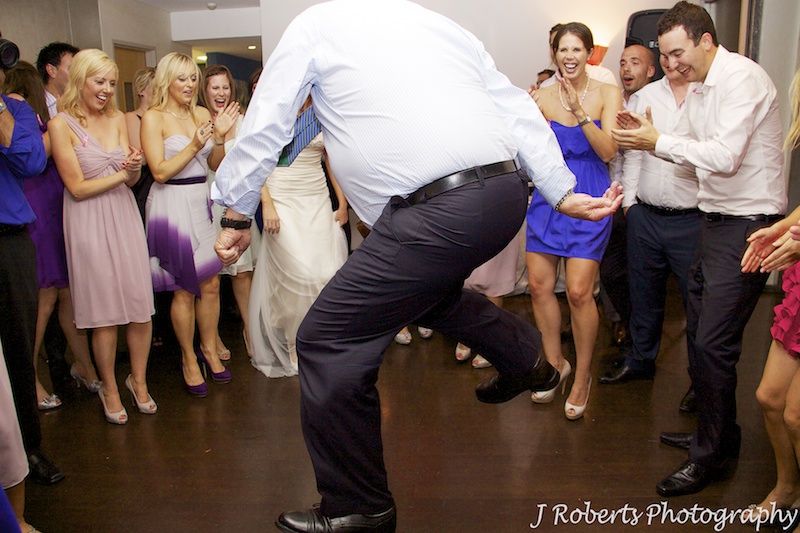Older man dancing in the circle on the dance floor - wedding photography sydney